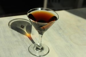 50 50 Manhattan cocktail in a martini glass.