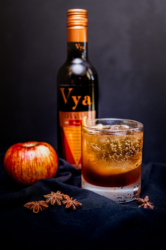 Fall Fizz vermouth cocktail with a bottle of Vya Sweet Vermouth, an apple and star anise