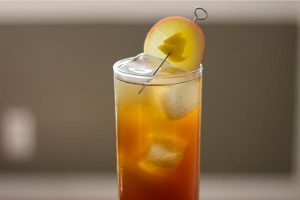 Fall Fizz with Quady Vya Sweet Vermouth in a high ball glass with a Apple slice garnish