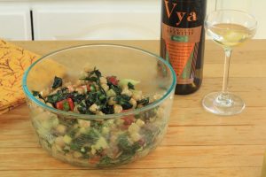 Bowl of bean salad next to a bottle and glass of Vya Extra Dry Vermouth.