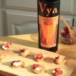 Cauliflower Bacon Fritters with Bacon next to a bottle of Vya Sweet Vermouth.