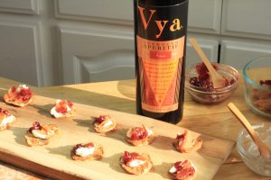 Cauliflower Bacon Fritters with Bacon next to a bottle of Vya Sweet Vermouth.