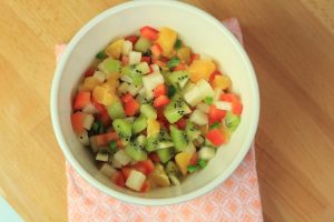 Kiwi tangerine salsa diced up in a bowl.