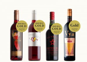 Red Electra Moscato, Elysium Black Muscat, Starboard Batch 88 port wine and Vya Sweet Vermouth lined up with various awards and medals present.