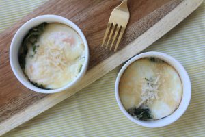 Baked egg, kale and cheese dishes.