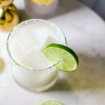 Quady Coco-Cream Margarita Recipe with Essensia Orange Muscat, coconut cream and Tequila in a rocks glass with a lime wheel garnish