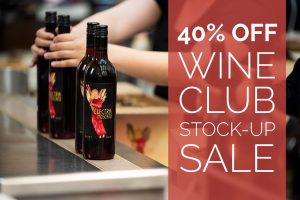 40% OFF Wine Club Stock up Sale text on top of a picture of Red Electra Moscato on a packaging line.