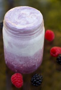 Red Electra Moscato float recipe with vanilla icecream surrounded by raspberries and black berries.