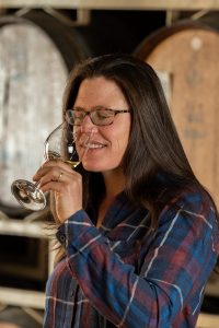 Allison Quady, daughter of Andrew and Laurel Quady, Health and Safety Manager for Quady Winery sipping a glass of Electra Moscato.