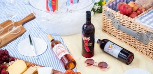 Picnic setting with bottles of Red Electra Moscato, Essensia Orange Muscat dessert wine and Elysium Black Muscat dessert wine.