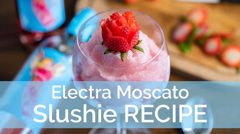Electra Moscato slushie in a wine glass with text overlay, "Electra Moscato Slushie Recipe."
