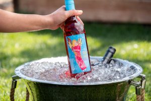 Electra Moscato Rose being put on top of ice with grass behind.