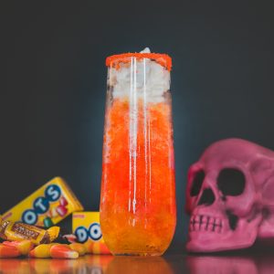 Electra Corn Candy Slushie paired with a skull and halloween candy