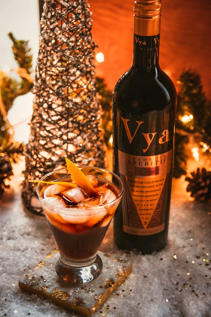 Bottle of Vya Sweet Vermouth with a glass of the Fancy Sour Vermouth Cocktail