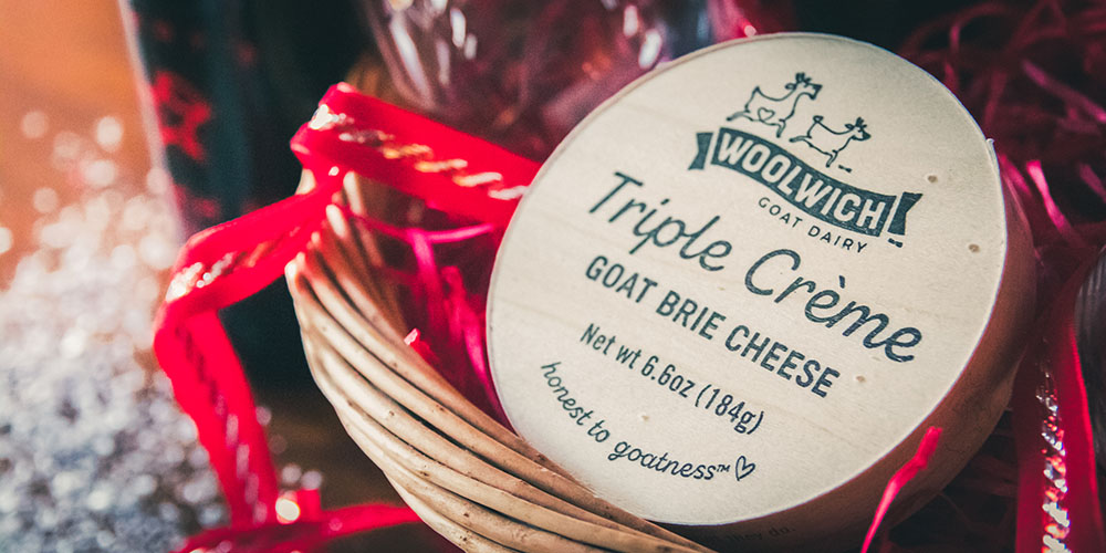 Goat brie cheese in a sweet wine gift basket