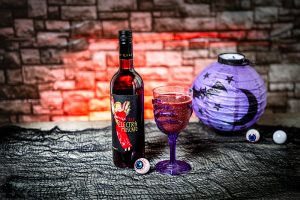 Red Electra Moscato with a cherry vanilla moscato slushie and Halloween decor
