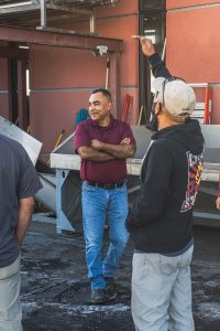Cellarmaster Juan Cuevas talking to a crew of winery workers