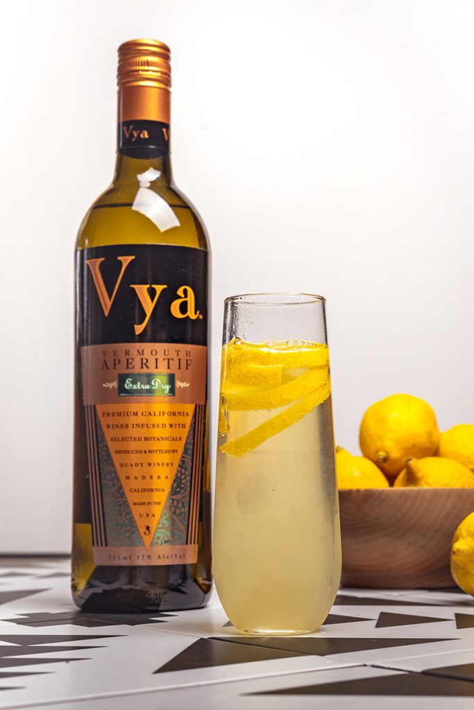 California 75 vermouth cocktail with Vya Extra Dry Vermouth and a bowl of lemons