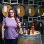 Consuelo Gil at the barrel room with Electra wines