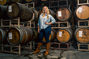 Quady winemaker Crystal Weaver-Kiessling in the barrel room at Quady Winery