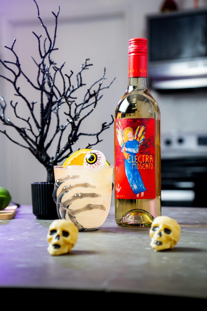 Halloween Party Punch with a bottle of Electra Moscato, skulls and a black tree