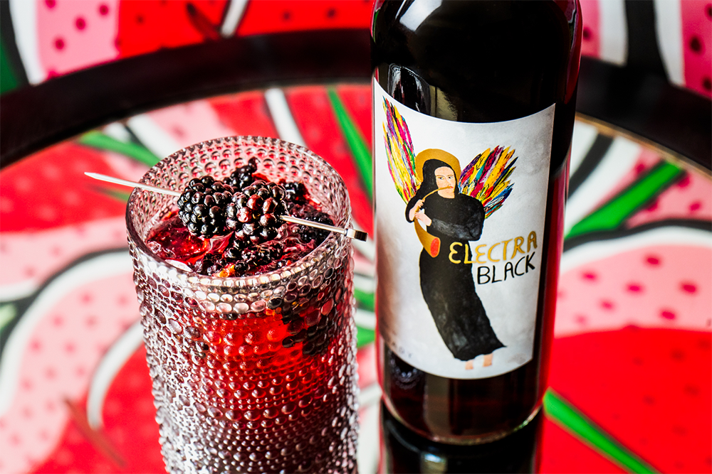 Blackberry Crush low-ABV spritzer with a bottle of Electra Black