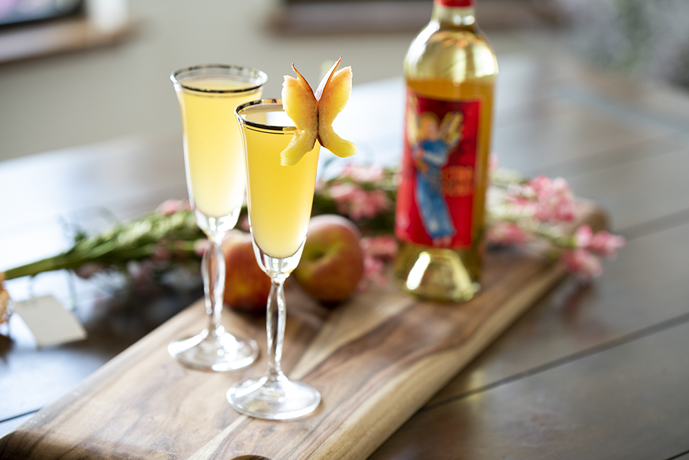 Electra Bellini dessert wine cocktail with peach garnish